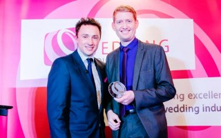 Damian Surr receiving The Wedding Industry Awards Trophy